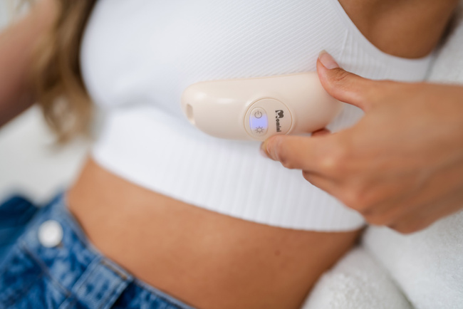 Rozgrzewający masażer laktacyjny 2w1 Momini Calma 